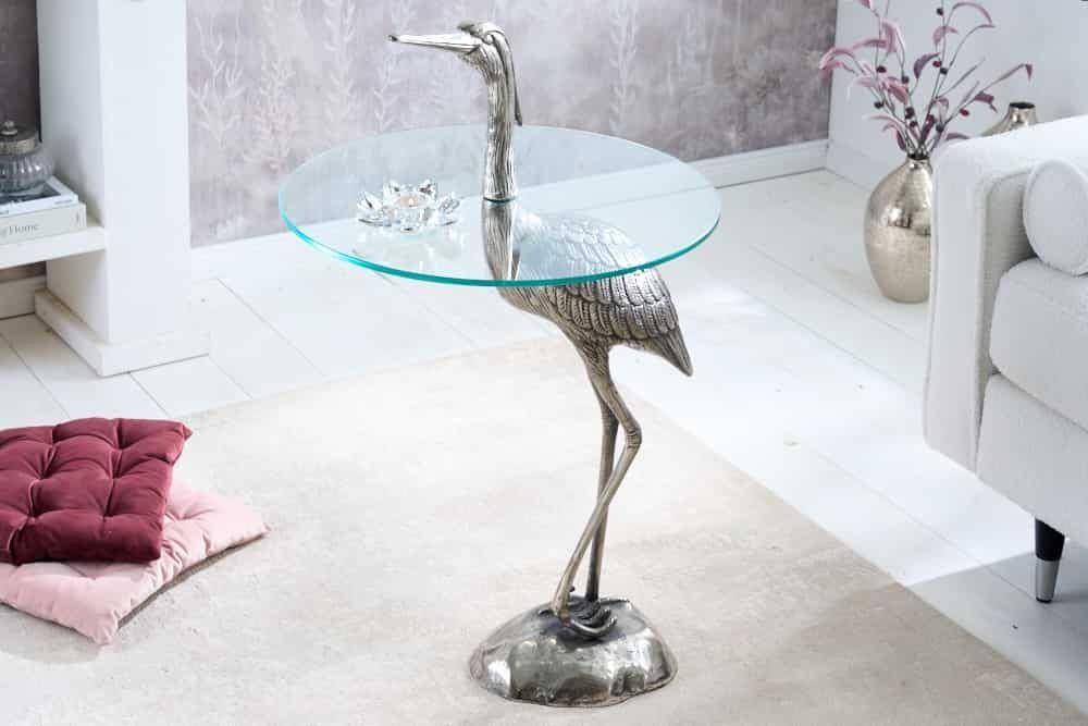 Ronde bijzettafel WildLife Heron – Zilveren metalen glastabel met sierlijke reigersculptuur